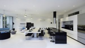  The interiors of the kitchen-living room in a modern style.