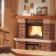 Corner fireplace in a wooden house